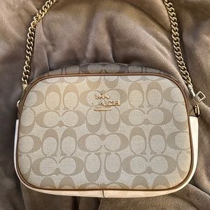 Coach 
JAMIE CAMERA BAG IN BLOCKED SIGNATURE CANVAS